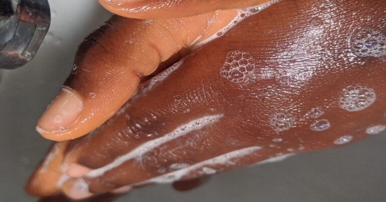 A student washing hands