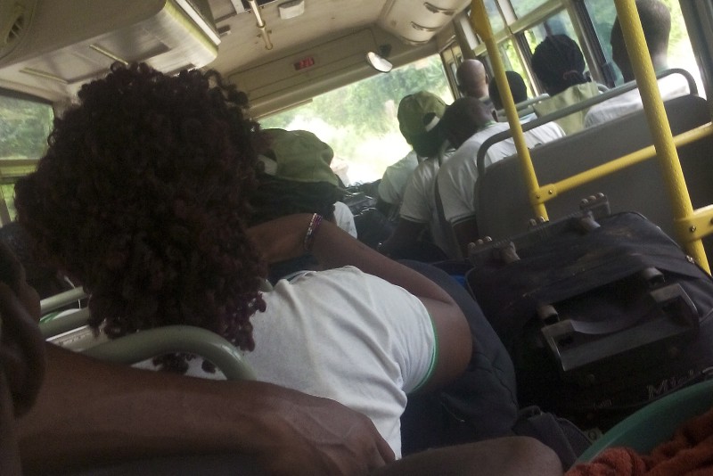 Corps members in a bus traveling from the nysc orientation camp